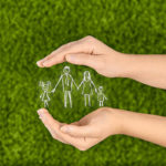 Image of hands protecting a family illustrates one of the main benefits of life insurance.